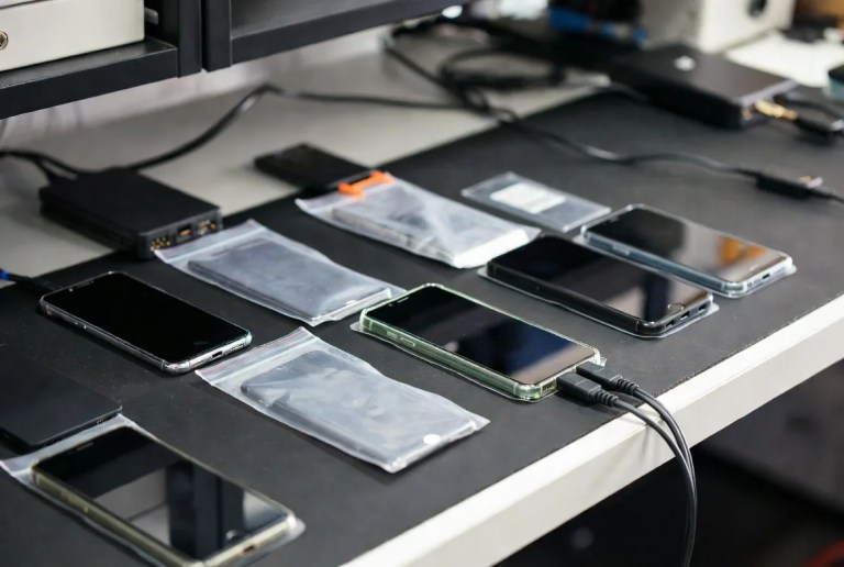 Phones sealed in labelled bags at the Wildfire Data Recovery intake and custody desk in the Brisbane lab