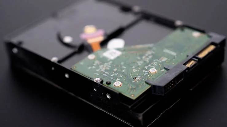 A hard drive circuit board on our lab bench, illustrating the board and ROM work in the power surge recovery case study